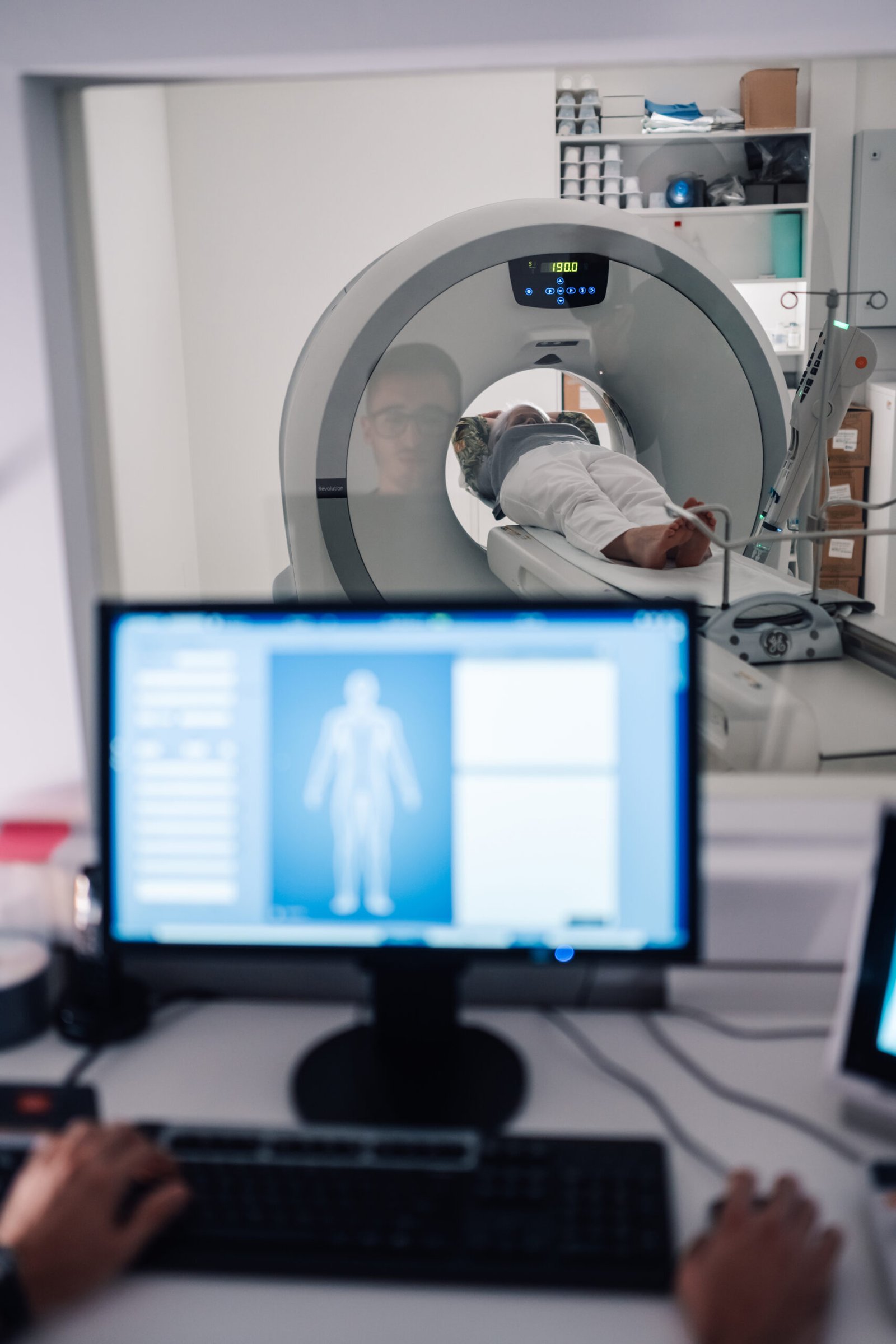 Technician conducting a CT scan
